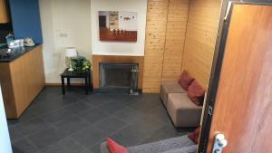 a living room with a couch and a fireplace at Beautiful villa in Póvoa de Lanhoso with pool and garden in Póvoa de Lanhoso +60 photos