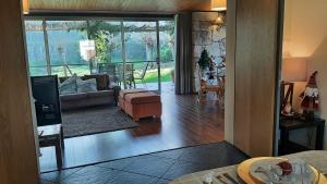 a living room with a couch and a chair at Beautiful villa in Póvoa de Lanhoso with pool and garden in Póvoa de Lanhoso