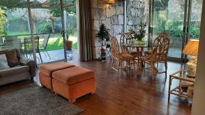 a living room with a table and chairs at Beautiful villa in Póvoa de Lanhoso with pool and garden in Póvoa de Lanhoso