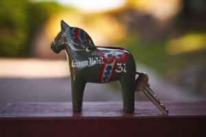 a small toy horse figurine sitting on a table at Green Hotel in Tällberg