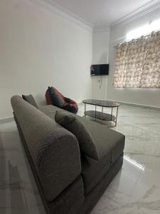 a living room with a couch and a table at DM Bliss in Chikmagalūr