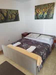 a bed with two towels on it in a room at Cosy Apartment in Ulcinj with Sea View - 40 m² in Ulcinj