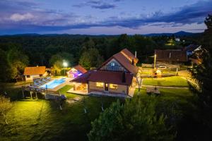 an aerial view of a house with a swimming pool at Peaceful Villa in Gornje Dubrave with Private Pool in Gornje Dubrave