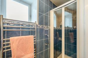 a bathroom with a glass shower with a towel at 1 Bed in Appledore oc-captv in Appledore +16 photos