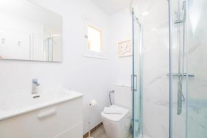 a bathroom with a shower and a toilet and a sink at PDM CA'N NOFRE in Playa de Muro +13 photos