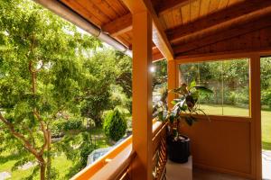 a view from the balcony of a house with a tree at Ferienwohnung Leibnitz Südsteiermark in Leibnitz