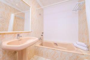 a bathroom with a sink and a bath tub at Can Fusteret in Son Serra de Marina +27 photos