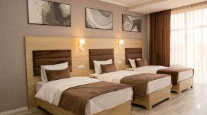 a hotel room with two beds in a room at Modern Hotel in Tashkent +31 photos