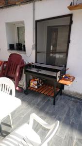 a piano sitting on top of a table at Spacious House in Tongeren in Tongeren