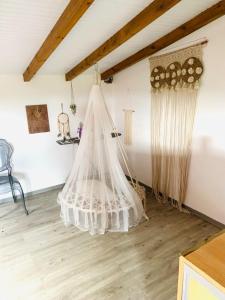 a room with a net hanging from the ceiling at Villa élégante à Anse-Bertrand avec piscine in Anse-Bertrand