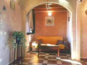 a living room with a couch and a table at Charming Villa in Noto with Private Pool in Noto