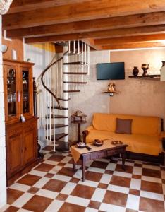 a living room with a couch and a table at Charming Villa in Noto with Private Pool in Noto +90 photos