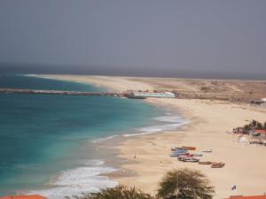a view of a beach with boats in the water at Atlantic Maio Hotel in Vila do Maio