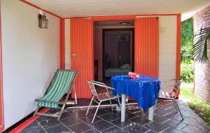 a table and two chairs on a patio at Charming Studio in Foulpointe, Sea View and Garden, 30 m² in Foulpointe
