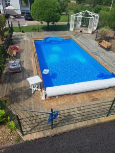 an overhead view of a swimming pool on a wooden deck at Marieborg Apartments in Ekshärad