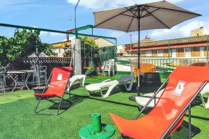 a group of chairs and an umbrella on a yard at Charming Villa in Vitigudino with Private Pool in Vitigudino