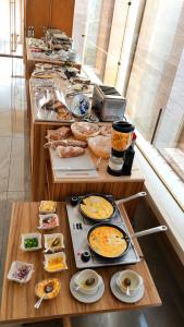 a buffet with many plates of food on a table at Flamingo Cairo Airport Hotel & Free Airport Pickup in Cairo