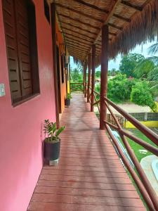 a porch of a house with plants on it at Flatmoitas in Amontada