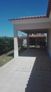 a porch with a gazebo on a house at Spacious house in Aldeia dos Pinheiros with pool in Azeitao
