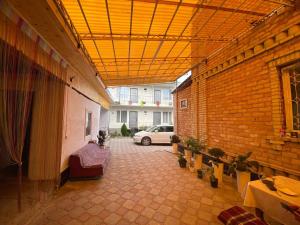 a hallway with a car parked in a building at Амир гостевой дом в Корумду in Korumdy