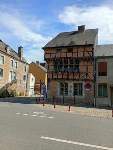 a building on the side of a city street at Les Reflets de Meuse in Revin