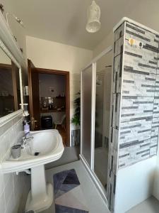 a bathroom with a sink and a shower at Bed and Breakfast Medaglia D'oro in Marcianise +18 photos