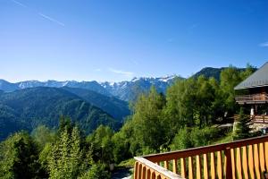 a view of the mountains from the balcony of a cabin at Chalet chaleureux à Ax-les-Thermes avec vue sur la montagne in Ax-les-Thermes