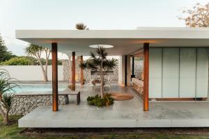 a house with a courtyard with a pool at The Pool House in Gqeberha