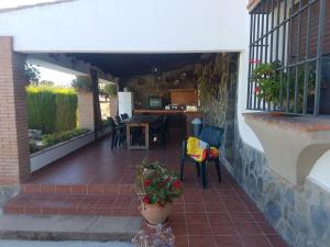 an outdoor patio with a table and chairs at Charming house in Arriate with private pool. in Arriate