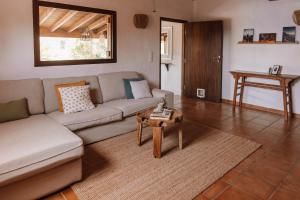 a living room with a couch and a table at Surfescape Fuerteventura in Lajares
