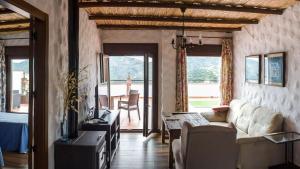 a living room with a couch and a table at Elegant Villa with Jacuzzi in Canillas de Albaida in Canillas de Albaida