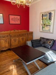 a living room with a couch and a table at Spacious House in Central Sofia with Garden in Sofia