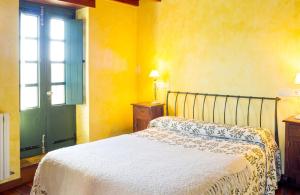 a bedroom with a bed and a green door at Luxurious Villa in Outeiro - Private Pool in Santa María La Mayor del Rosario