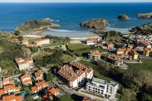 an aerial view of a resort near the ocean at AP TXALUPA II in Barro de Llanes