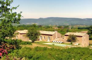 an aerial view of a large brick building at Villa spacieuse à Oppède avec piscine et vue imprenable in Oppède
