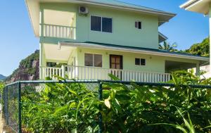 a house on a hill with a fence at Elegant Villa with Sea View in Victoria in Victoria