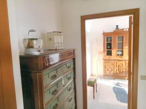 a kitchen with a dresser with a blender on top of it at Charming Apartment in Vibo Valentia with Terrace, 60 m² in Vibo Valentia +17 photos