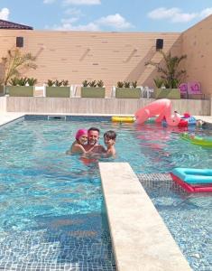 a group of people in a swimming pool at Hanul Marioarei in Buneşti