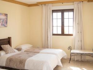 a bedroom with two beds and a window at Idyllic House in Yegen with Mountain View in Yegen +20 photos