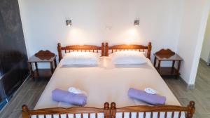 a bedroom with a large bed with two pillows at Comfortable Studio in Sumartin with Sea View - 22 m² in Sumartin +53 photos
