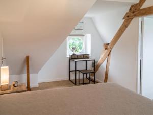 a bedroom with a bed and a window at Maison chaleureuse à Erquy avec jardin et parking in Erquy