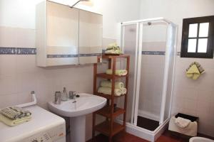 a white bathroom with a sink and a shower at Spacious Villa in Conil de Frontera with Private Pool in Roche +36 photos