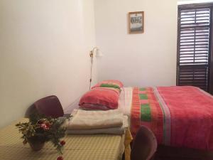 Postel nebo postele na pokoji v ubytování B&B LOKEV Sezana