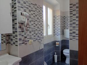 a bathroom with a shower and a toilet at Antica Tibur in Tivoli