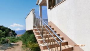 a staircase leading up to a building with a window at Charming Apartment with Sea View, Gdinj, 70 m², Garden in Gdinj +38 photos