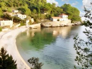 a view of a river with houses on the shore at Charming Apartment with Sea View, Gdinj, 70 m², Garden in Gdinj