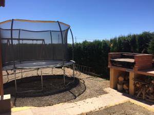 a trampoline in a cage in a yard at House with private pool in Aguilas, sea & pool view in Águilas