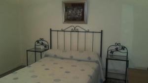 a bedroom with a bed with two glass shelves at House with private pool in Aguilas, sea & pool view in Águilas +32 photos