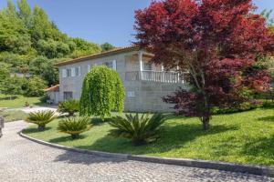 a house with a garden in front of it at Casa Monte Cordova in Monte Córdova