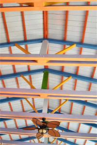 a ceiling with many different colored sticks on it at Elegant Villa with Sea View in Politika in Politika